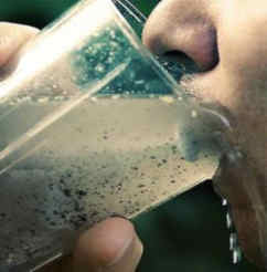 a person drinking contaminated water